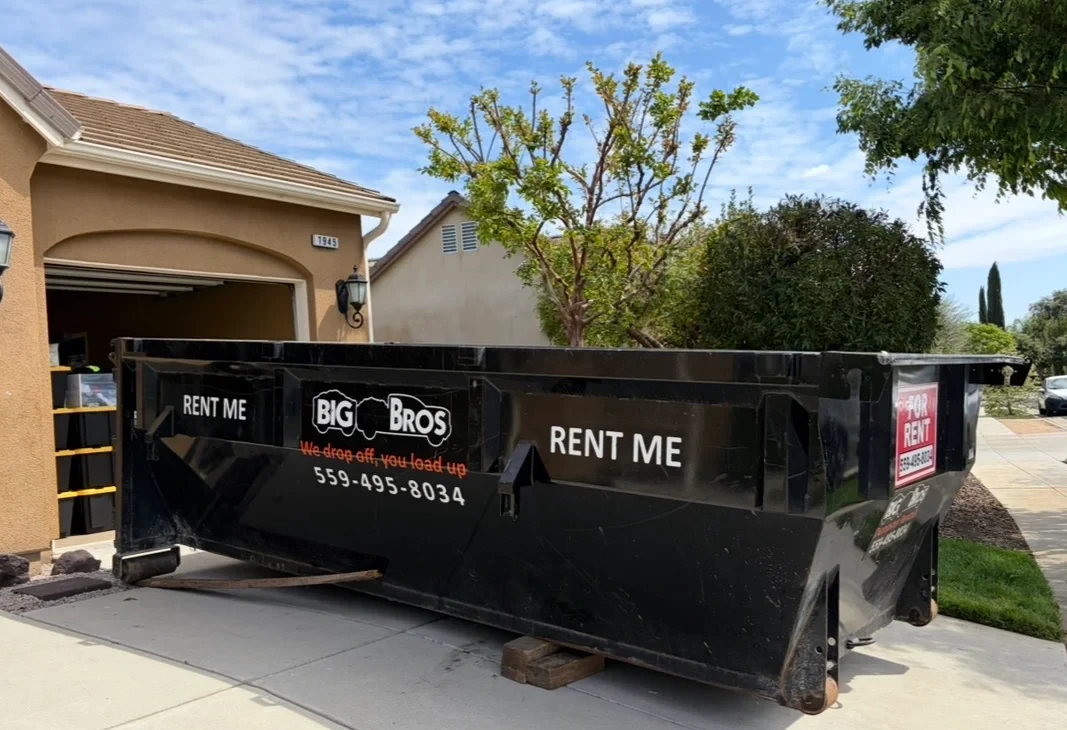 Big Bros Dumpster Rentals commercial roll-off delivery truck in Fresno, CA